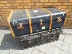 A shipping trunk with wood banding and a metal trunk with clasp - [2]