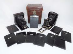 Bellows Cameras - two vintage Bellows concertinaed cameras one marked to the strap Cameo and the