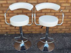 Two bar stools with cream seats and backs approx 89cm (h)