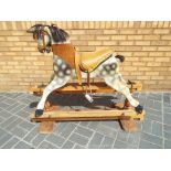 Rocking Horse - a vintage dapple grey rocking horse with studded leather tack,