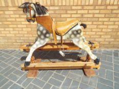 Rocking Horse - a vintage dapple grey rocking horse with studded leather tack,