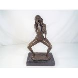 A hot cast bronze depicting a female on a marble plinth, approximate height 31 cm (h).