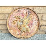 A large cast iron wall plaque featuring a depiction of a Liver Bird,