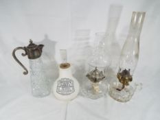 Two glass oil / paraffin lamps,