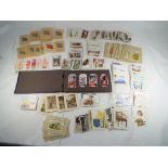 Cigarette Cards - a quantity of cigarette cards and similar to include The Bonzo series,