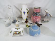 A mixed lot of ceramics to include three Nao figurines, a light blue Jasper Ware lidded pot,