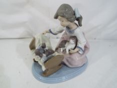 Lladro - A Lladro figurine # 5784, A Cradle of Kittens, stamped and impressed marks to the base,