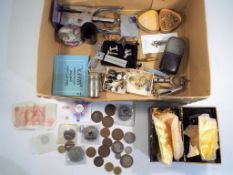 A small quantity of UK and foreign coins, a tin containing sheets of gold leaf, hip flask,