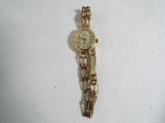 A hallmarked 9ct yellow gold Geneve lady's wristwatch weight 9.