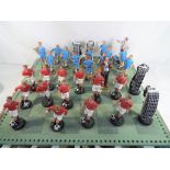 A chess set, the pieces in the style of football teams,