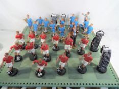A chess set, the pieces in the style of football teams,