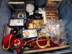 A vintage travel case containing a large quantity of good quality costume jewellery to include