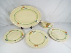 Clarice Cliff - A hand painted Wilkinsons Ltd floral design platter with cabinet plates and gravy