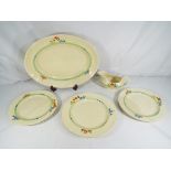 Clarice Cliff - A hand painted Wilkinsons Ltd floral design platter with cabinet plates and gravy