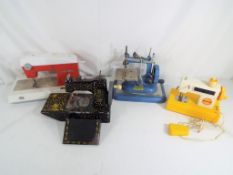 Four children's sewing machines to include Vulcan,