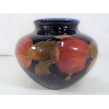 Moorcroft Pottery - A large bulbous squat vase decorated in pomegranate pattern,