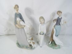 Lladro - Three Lladro figurines to include # 1052 Girl with Goose, # 4868 Girl with Chamberstick,