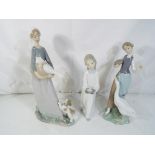 Lladro - Three Lladro figurines to include # 1052 Girl with Goose, # 4868 Girl with Chamberstick,