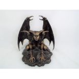 A figurine depicting a fantasy mythological creature,