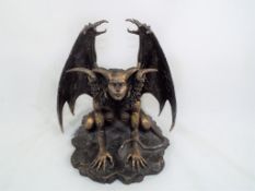 A figurine depicting a fantasy mythological creature,