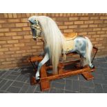 Haddon Rocking horse - a Haddon dapple grey rocking horse with leather tack,