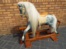 Haddon Rocking horse - a Haddon dapple grey rocking horse with leather tack,