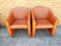 A pair of matching super quality tan leather tub chairs Est £20 - £40