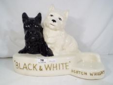 A Black and White Scotch Whisky ceramic advertising display by Crown Devon, approx 25.