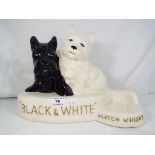 A Black and White Scotch Whisky ceramic advertising display by Crown Devon, approx 25.