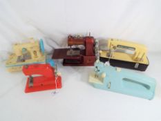 Five vintage children's sewing machines to include Vulcan,