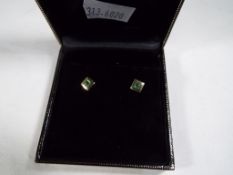 A pair of 9ct yellow gold earrings set with jade stamped 375
