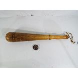 A turned wooden truncheon approx 43.