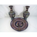 A pair of Chinese cloisonne vases depicting five clawed dragons chasing a flaming pearl,