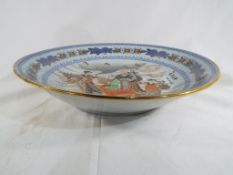 A very large Asian footed bowl, floral decoration to the rim,
