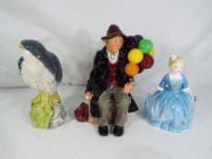 Royal Doulton - A Royal Doulton figurine HN1954 The Balloon Man, approximately 18.