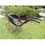 A Victorian doll's push pram with 32 cm (diameter) spoked wheels This lot MUST be paid for and