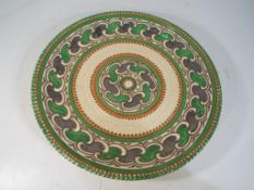 Charlotte Rhead - A Charlotte Rhead for Crown Ducal tubelined charger decorated in the Green Chain
