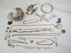 Silver - a collection of predominantly silver costume jewellery to include bangles, bracelets,