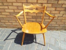 Ercol - a vintage beech and elm carver chair with cowhorn arms, ca 1964-1967,