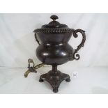 A Georgian copper twin handled Samovar, with purchase receipt dated March 8th 1982,