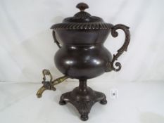 A Georgian copper twin handled Samovar, with purchase receipt dated March 8th 1982,
