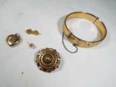 A good mixed lot to include a pair of 9ct gold earrings,