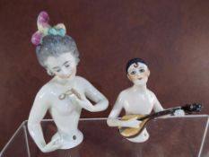 Two 1920's / 1930's ceramic style half doll pin cushions both inscribed markings verso 5769 and