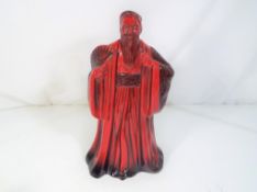 Royal Doulton - a Royal Doulton figurine in the Flambe pattern entitled Confucius HN3314.