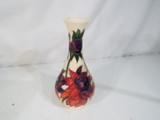 Moorcroft - a Moorcroft vase decorated in the Red Ruby pattern, approximate height 17 cm.
