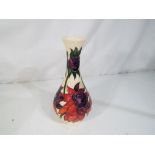 Moorcroft - a Moorcroft vase decorated in the Red Ruby pattern, approximate height 17 cm.