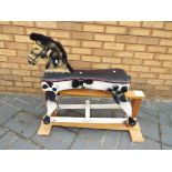 A wooden hand-painted rocking horse,
