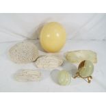 A mixed lot to include an ostrich egg, coral / sponge samples, onyx eggs and similar.