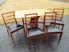 G Plan furniture - a teak drop-leaf dining table and four McIntosh ladder-back dining chairs with