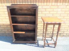 A good lot to include a bookcase with carved decoration with three shelves,